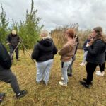 Early Years and Education students being shown how to build a den.